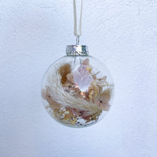 Load image into Gallery viewer, Individually packaged clear glass Christmas bauble filled with nude, natural and white preserved flowers. Unique Christmas tree decoration created by Melbourne florist Joyful Blooms. Perfect gift option for teacher gifts, stocking fillers, Christmas table settings.
